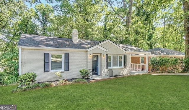 single story home with a porch and a front yard