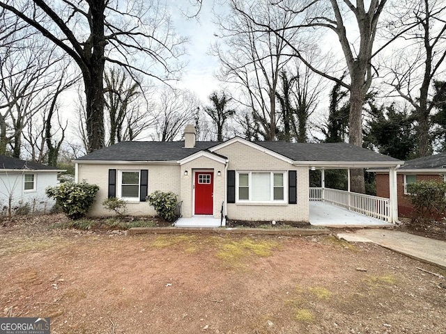 2174 Doris Dr, Decatur, GA 30034 - single story home with brick siding, concrete driveway, a chimney, and an attached carport