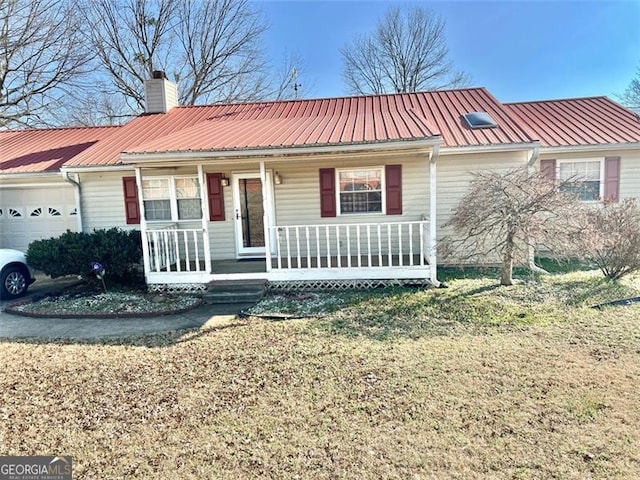 ranch-style home with a porch, a garage, and a front lawn