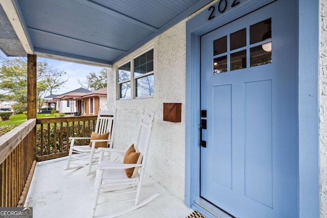 property entrance with a porch