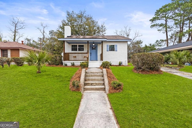 bungalow-style house featuring a front yard and covered porch