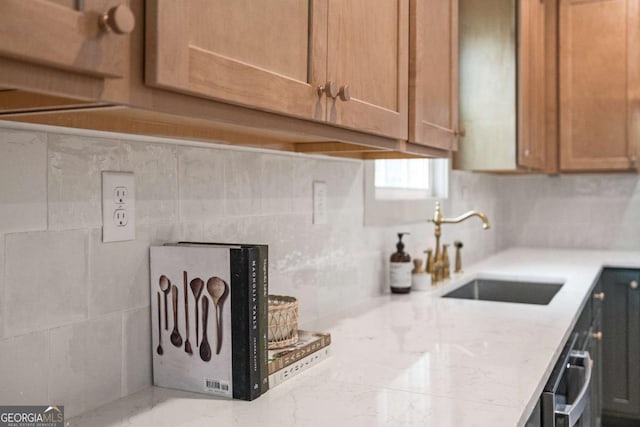 kitchen featuring sink and backsplash