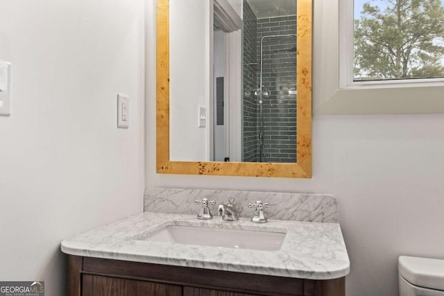 bathroom with vanity and toilet