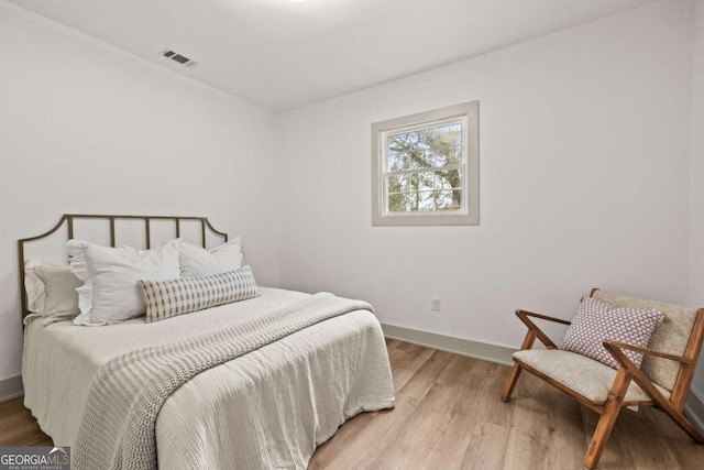 bedroom featuring hardwood / wood-style flooring