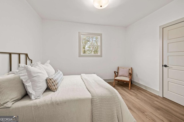 bedroom with light hardwood / wood-style floors