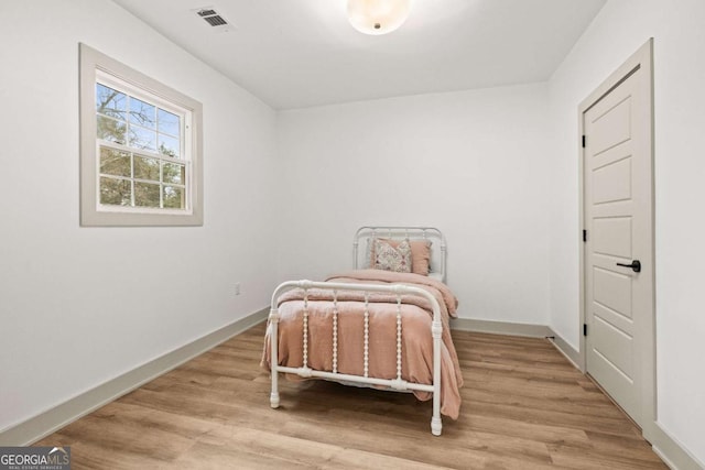 bedroom with light wood-type flooring