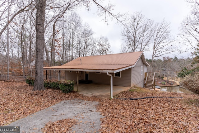 view of side of property with a carport