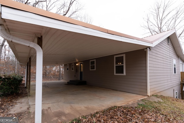 view of vehicle parking featuring a carport