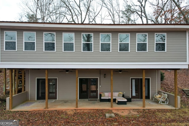 back of property featuring ceiling fan and a patio area