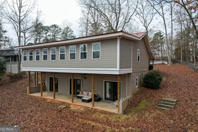 back of house with a patio