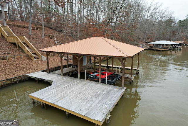 dock area featuring a water view