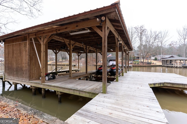 dock area with a water view