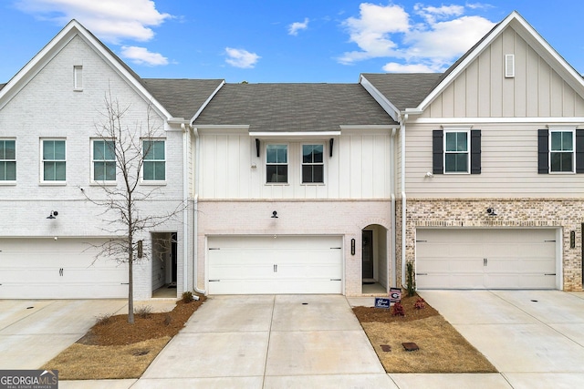 townhome / multi-family property featuring a garage