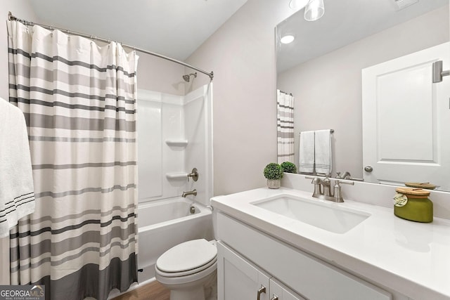 full bathroom featuring toilet, vanity, and shower / bath combo