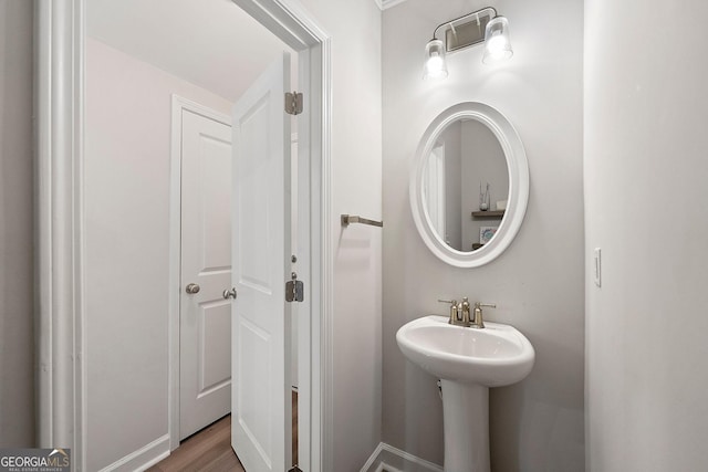 bathroom with hardwood / wood-style flooring