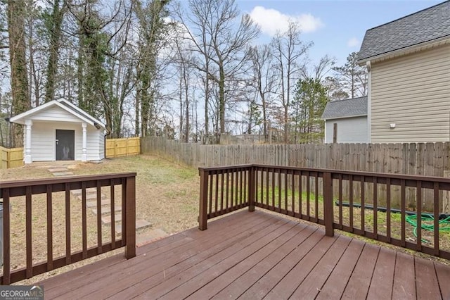 deck featuring a shed and a yard