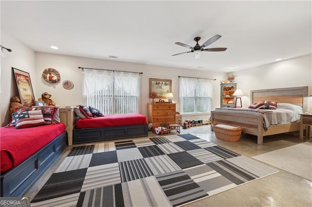 bedroom featuring ceiling fan and concrete flooring