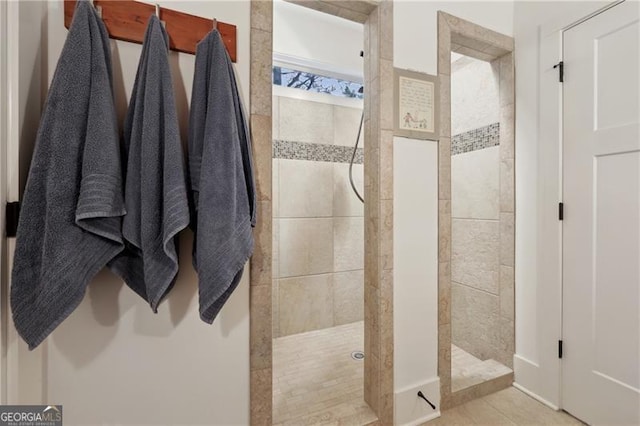 bathroom with tiled shower