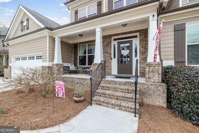 entrance to property featuring a porch