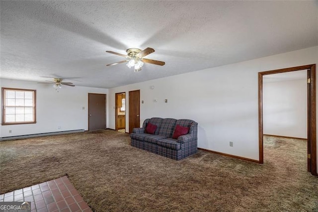 242 Herring Gull Ct, Monticello, GA 31064 - living room featuring ceiling fan, a baseboard heating unit, a textured ceiling, and dark colored carpet