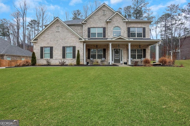 craftsman inspired home with a porch and a front yard