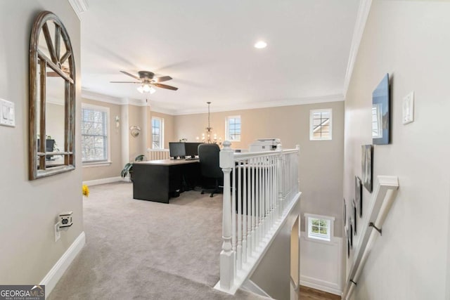 carpeted office space featuring ceiling fan and ornamental molding