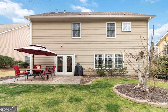 7856 Keepsake Ln, Flowery Branch, GA 30542 - rear view of property featuring french doors, a patio, and a yard