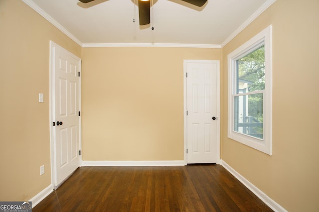 unfurnished room featuring ceiling fan, ornamental molding, and dark hardwood / wood-style floors