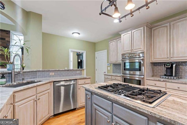 3130 Kates Way NW, Kennesaw, GA 30152 - kitchen with appliances with stainless steel finishes, a sink, and decorative backsplash