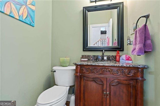 3130 Kates Way NW, Kennesaw, GA 30152 - half bathroom featuring vanity and toilet