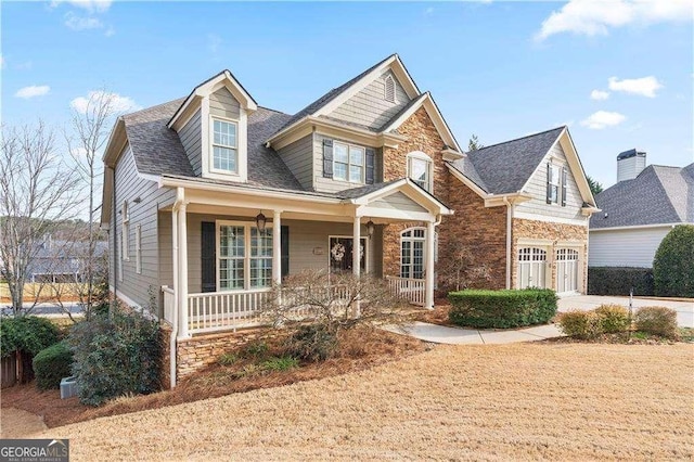 view of front facade with a garage and covered porch