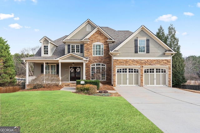 3130 Kates Way NW, Kennesaw, GA 30152 - view of front facade featuring stone siding, a porch, driveway, a garage, and a shingled roof