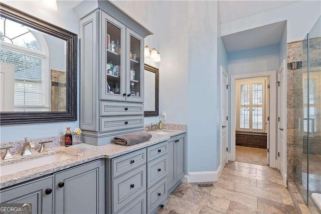 3130 Kates Way NW, Kennesaw, GA 30152 - bathroom featuring healthy amount of natural light, a shower stall, double vanity, and baseboards