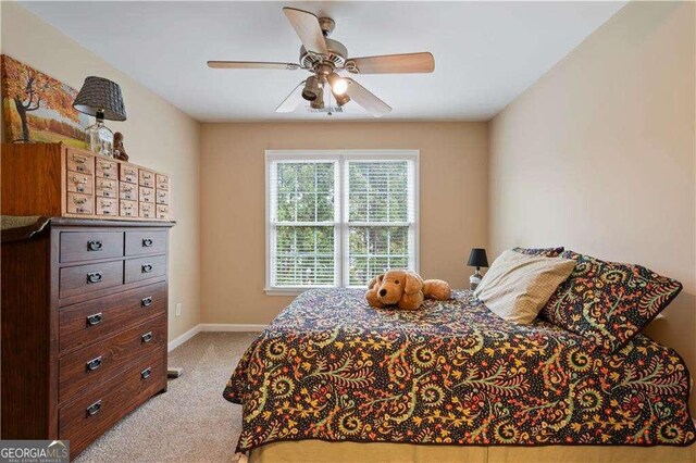 3130 Kates Way NW, Kennesaw, GA 30152 - bedroom with light colored carpet, baseboards, and a ceiling fan