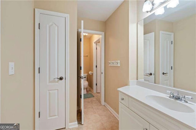 3130 Kates Way NW, Kennesaw, GA 30152 - bathroom with tile patterned flooring, toilet, vanity, and baseboards