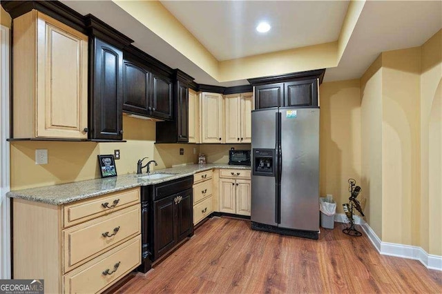 3130 Kates Way NW, Kennesaw, GA 30152 - kitchen with stainless steel fridge with ice dispenser, a sink, wood finished floors, baseboards, and light stone countertops