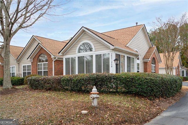 view of front of home featuring a sunroom