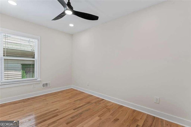 unfurnished room featuring hardwood / wood-style floors and ceiling fan