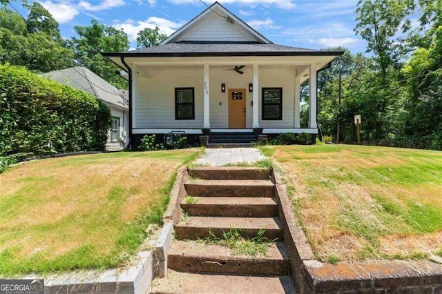 view of front facade with covered porch and a front lawn