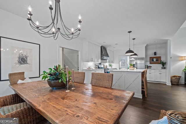 dining space with dark wood-type flooring and sink