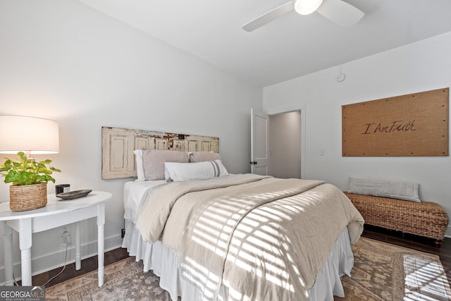 bedroom featuring dark hardwood / wood-style floors and ceiling fan