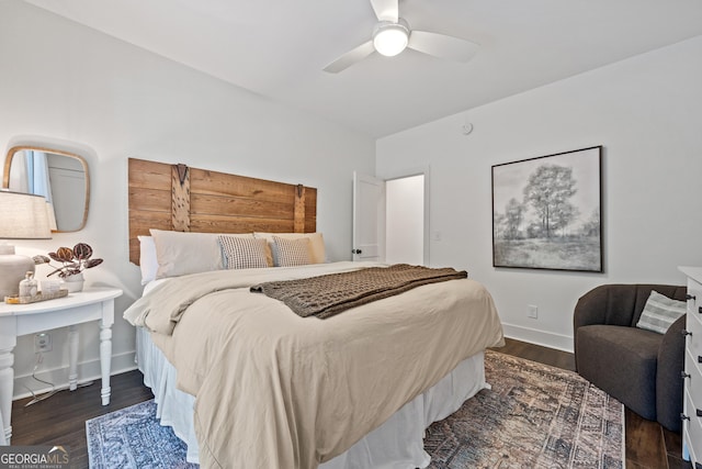 bedroom featuring dark hardwood / wood-style flooring and ceiling fan