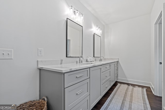 bathroom featuring vanity and hardwood / wood-style floors