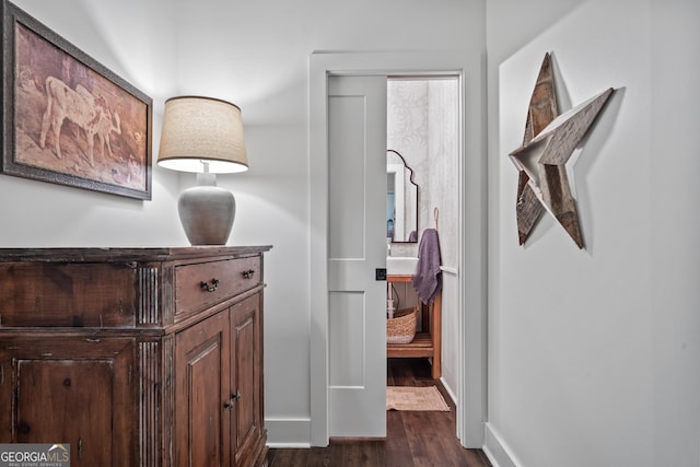 corridor featuring dark hardwood / wood-style floors