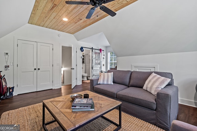 living room with dark hardwood / wood-style floors, lofted ceiling, ceiling fan, wood ceiling, and a barn door