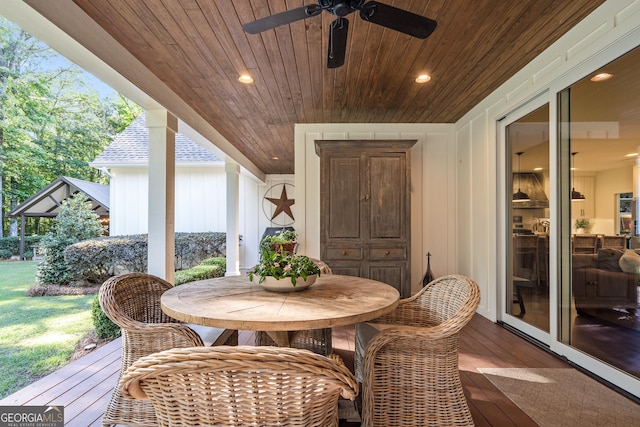 exterior space featuring wood ceiling and ceiling fan