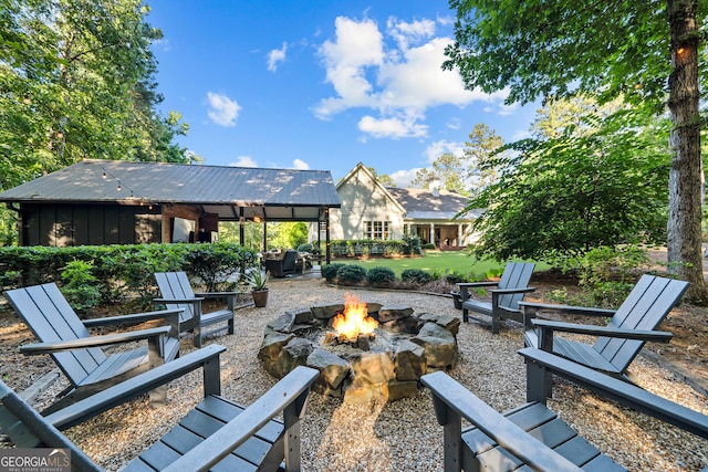 view of patio with a gazebo and an outdoor fire pit