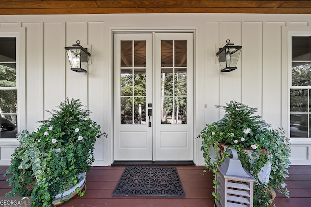 view of exterior entry featuring french doors