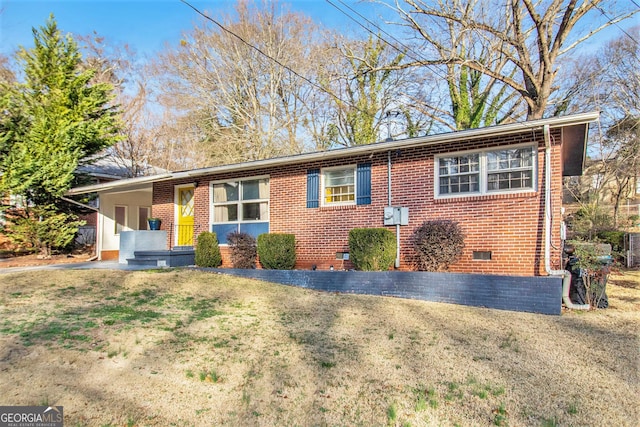 ranch-style house with a front lawn