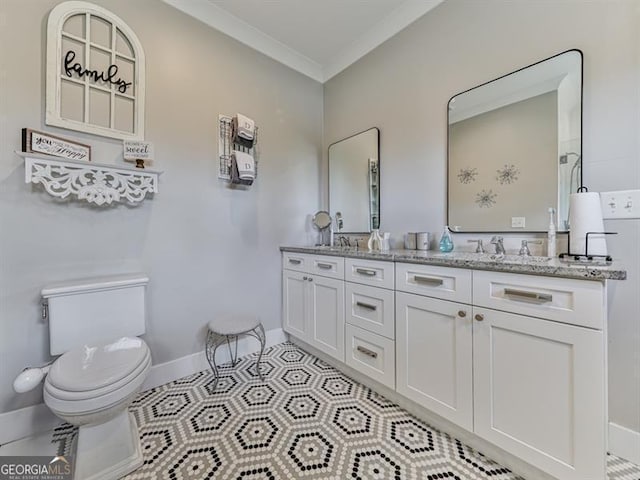 full bathroom with tile patterned flooring, crown molding, baseboards, toilet, and double vanity